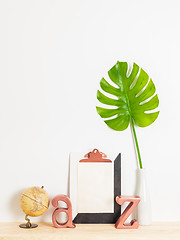 Image showing Modern home decor with blank sheet of paper on a clipboard