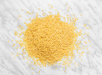 Image showing Orzo pasta on marble background