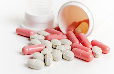 Image showing Pills and capsules in a jar on a white background