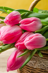 Image showing Beautiful bouquet of pink tulips in a wicker basket