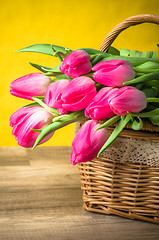 Image showing Beautiful bouquet of pink tulips in a wicker basket