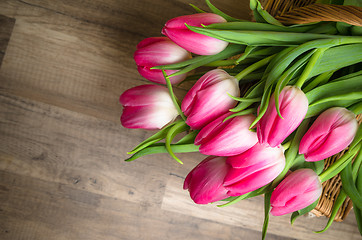 Image showing Beautiful bouquet from pink tulips  on a table