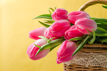 Image showing Beautiful bouquet of pink tulips in a wicker basket