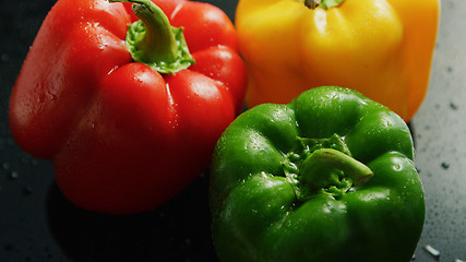 Image showing Colorful bell peppers in drops