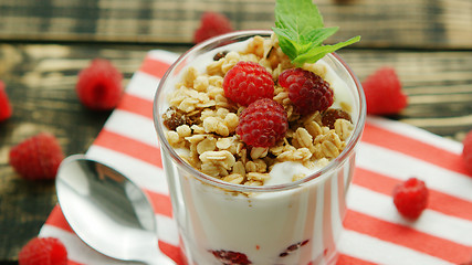Image showing Glass of yogurt with granola and berries