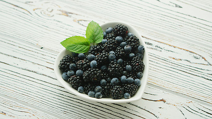 Image showing Heart shaped bowl with berries