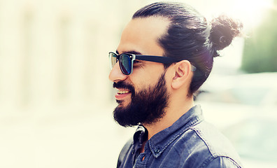 Image showing happy smiling man with beard on city street