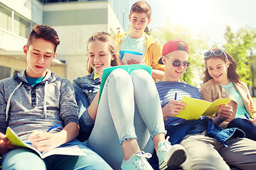 Image showing group of students with notebooks at school yard