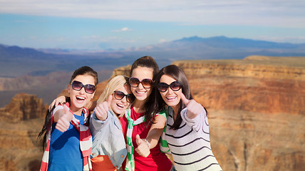 Image showing teenage girls or young women showing thumbs up