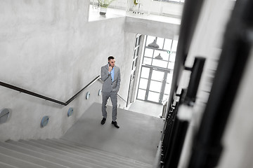 Image showing businessman walking upstairs