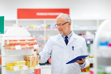 Image showing senior with tablet pc at pharmacy