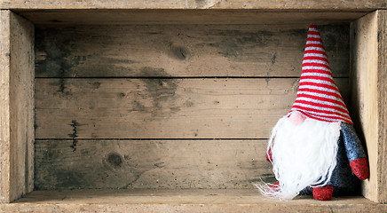 Image showing Christmas decoration with a gnome in a wooden box background