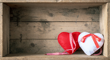 Image showing felt hearts on a wooden background