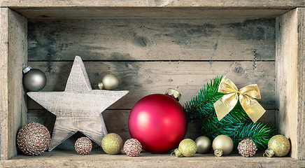 Image showing Typical Christmas symbols decoration on a wooden background