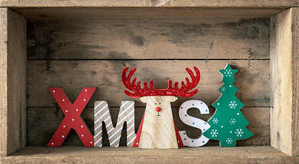 Image showing Christmas symbols decoration wooden reindeer with xmas text
