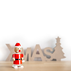 Image showing a sweet Santa Claus toy with space for your content