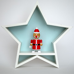 Image showing Christmas decoration white star with funny Santa Claus figure in
