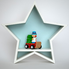 Image showing Christmas decoration white star with funny figure inside