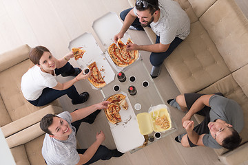 Image showing Pizza time a group of people