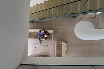 Image showing mother and her cute little daughter are using a tablet top view