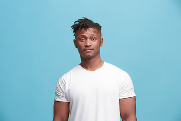 Image showing Handsome afro-american man looking suprised isolated on blue