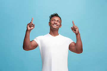 Image showing Winning success afro-american man happy ecstatic celebrating being a winner. Dynamic energetic image of male model