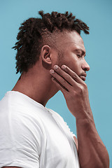 Image showing Young Afro-American man is having toothache.