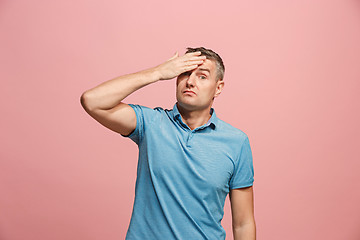 Image showing Young serious thoughtful businessman. Doubt concept.