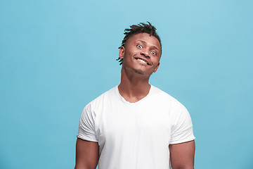 Image showing The squint eyed afro-american man with weird expression isolated on blue