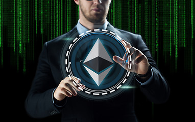 Image showing businessman hand with ethereum over binary code