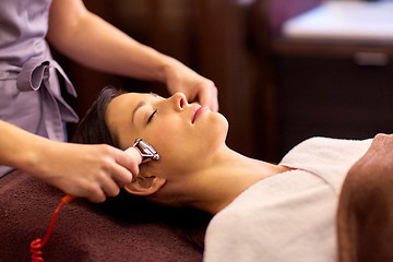 Image showing woman having hydradermie facial treatment in spa