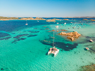 Image showing Drone aerial view of catamaran sailing boat in Maddalena Archipelago, Sardinia, Italy.