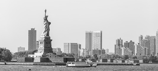 Image showing Statue of Liberty with Liberty State Park and Jersey City skyscrapers in background, USA