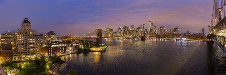 Image showing Brooklyn Bridge and Lower Manhattan skyline at night, New York city, USA.