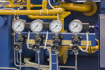 Image showing System's cooper pipes with Four manometers with valves