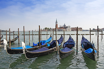 Image showing A view of Venice lagoon and gondolas,  the Cathedral of San Gior