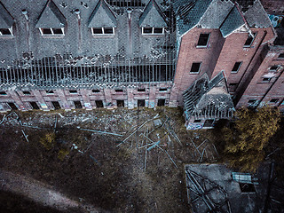 Image showing Dilapidated neglected old building factory falling into ruin and disrepair