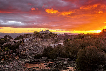 Image showing Sunset skies looking across the cliff to the distant mountains