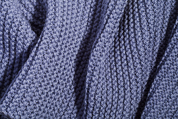 Image showing Blue wool knitted scarf.