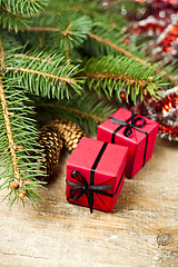 Image showing Christmas fir tree with pinecones and decorative boxes.