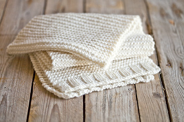 Image showing Hand knitted white scarf.