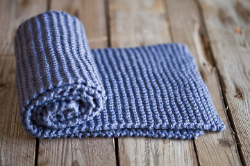 Image showing Hand knitted blue scarf.