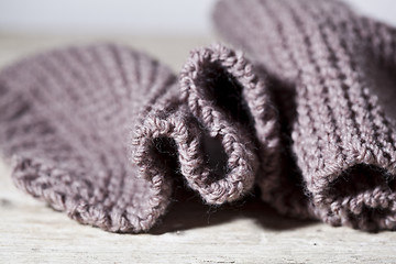 Image showing Knitted brown scarf.