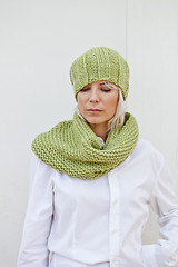 Image showing Woman in warm green knitted hat and snood.