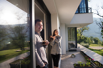 Image showing couple enjoying on the door of their luxury home villa