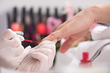 Image showing Woman hands receiving a manicure