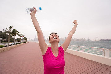 Image showing young woman celebrating a successful training run