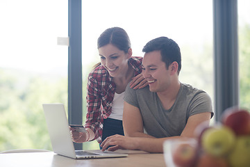 Image showing happy young couple buying online