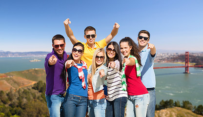 Image showing group of happy friends over golden gate bridge