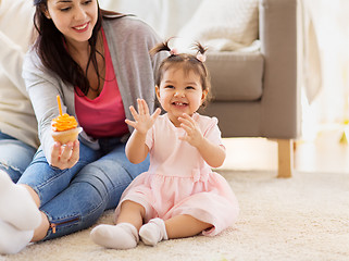 Image showing baby girl with mother at home birthday party